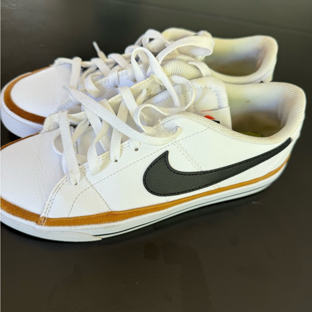 Nike White and Black Sneakers with Gold Accent